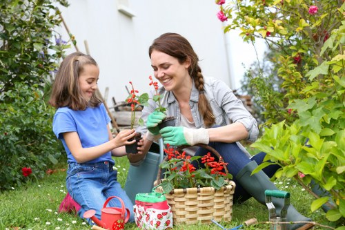 Volunteers sorting garden waste at a community recycling hub